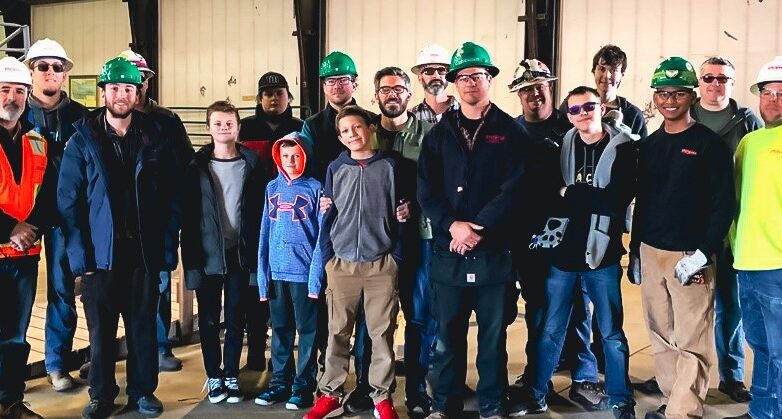 Sturgeon Electric team with a group of students
