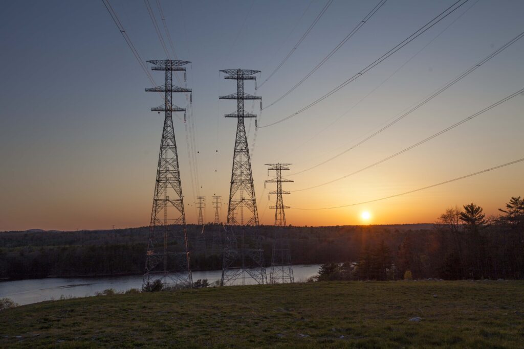Transmission towers during sunset