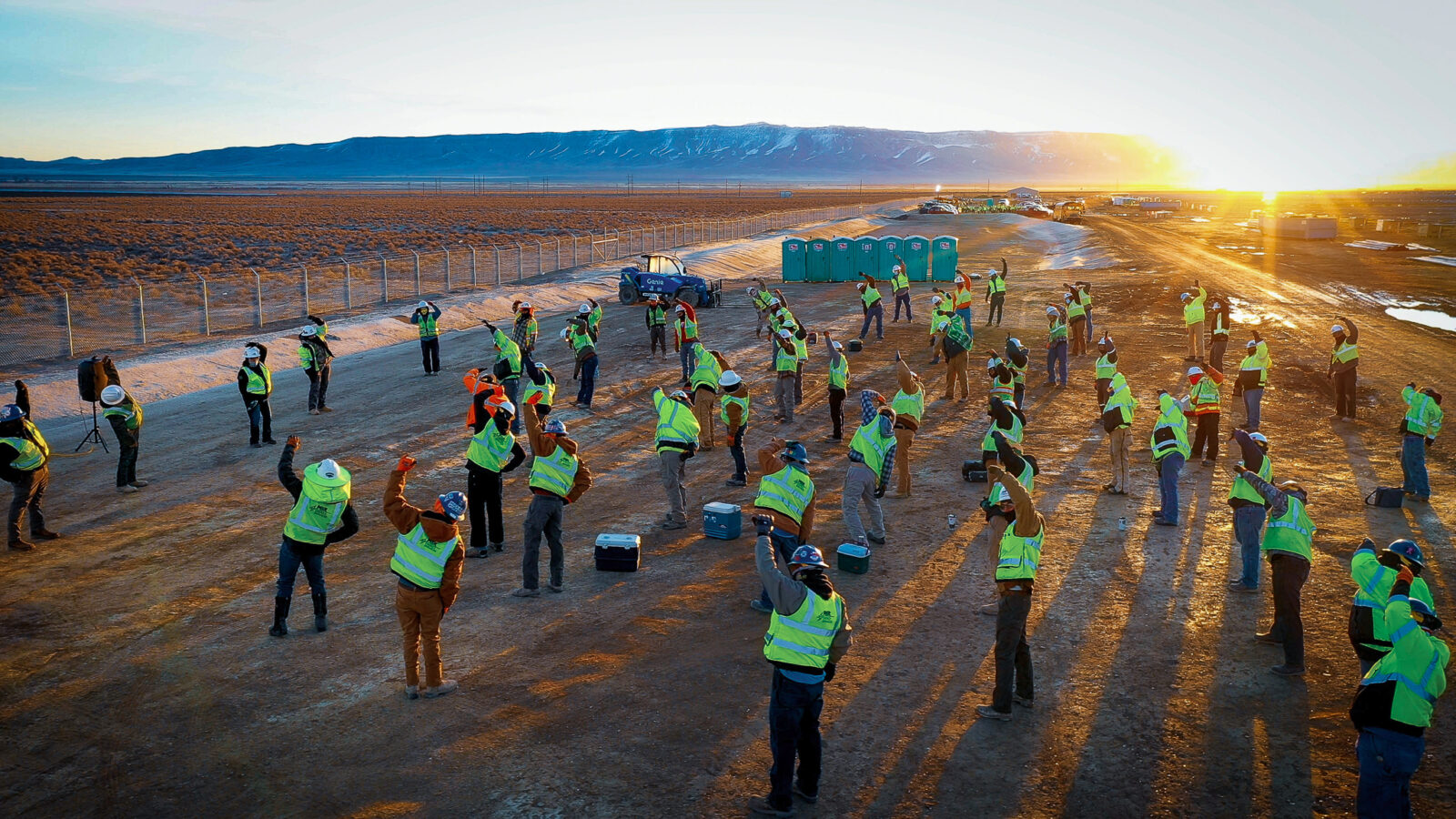 Group of MYRE Energy employees stretching prior to work