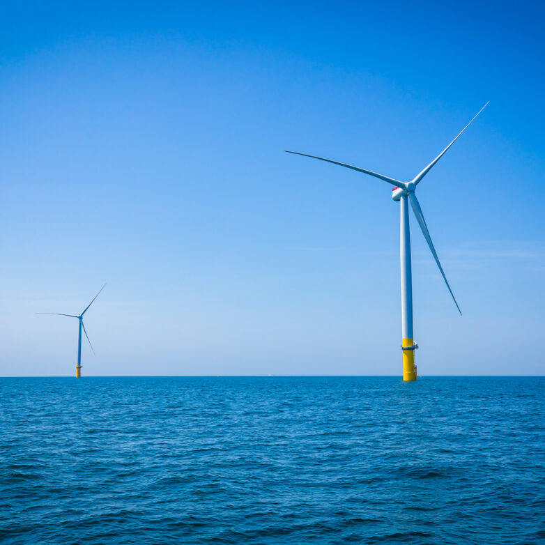 Two wind turbines on an ocean