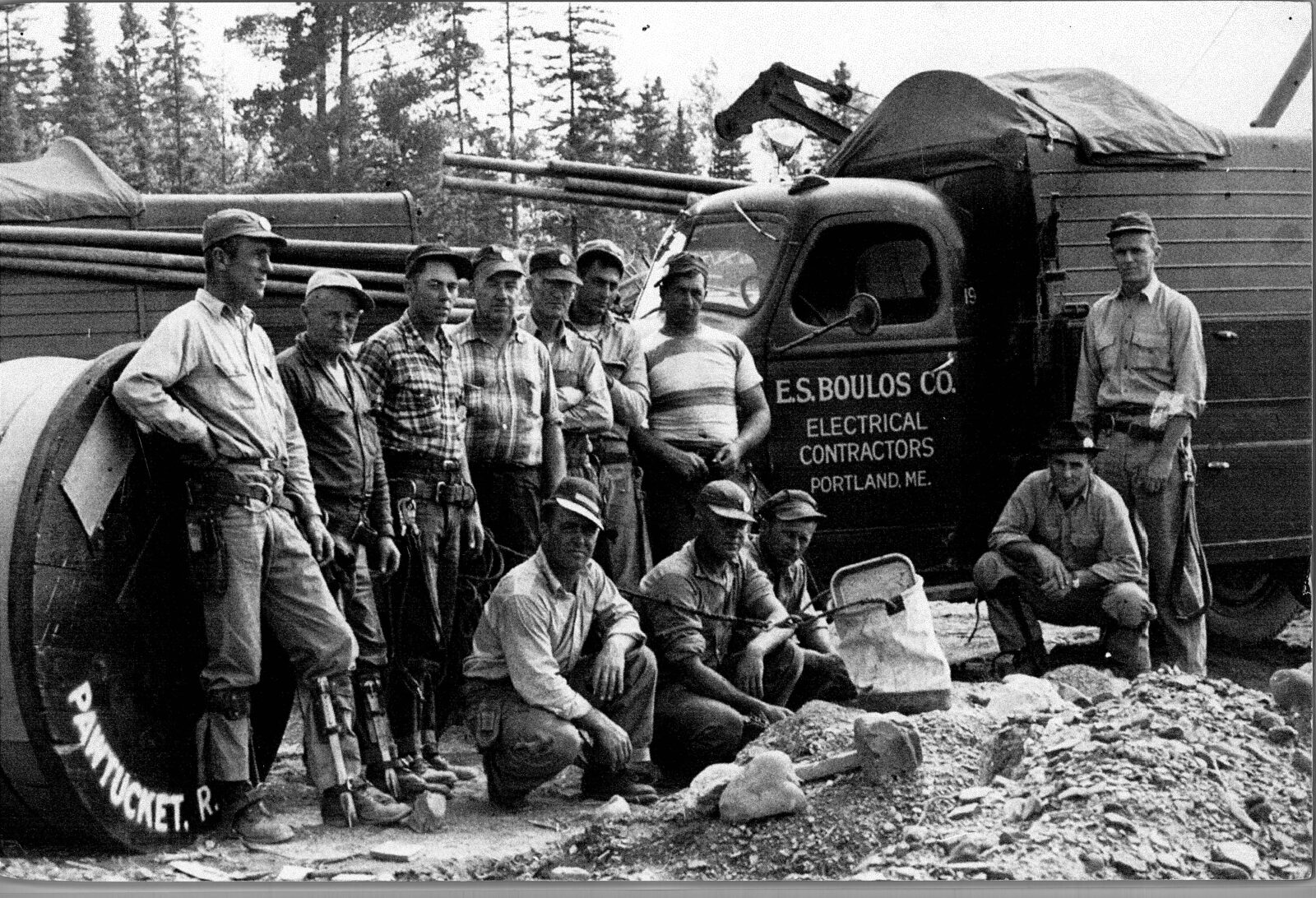 Group of workers in front of a E.S. Boulos Co. truck
