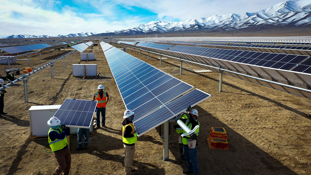 Workers install solar modules in Nevada