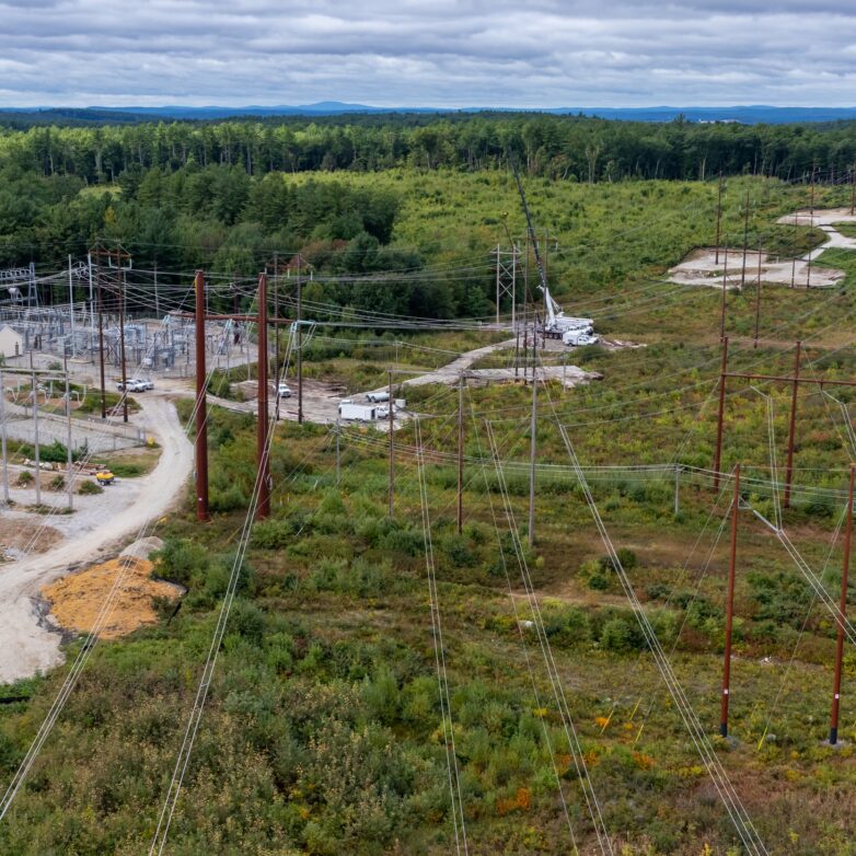An aerial view of transmission lines being worked on
